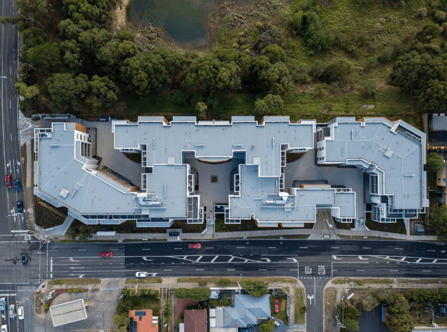 Aerial view of commercial building with premium metal roofing system